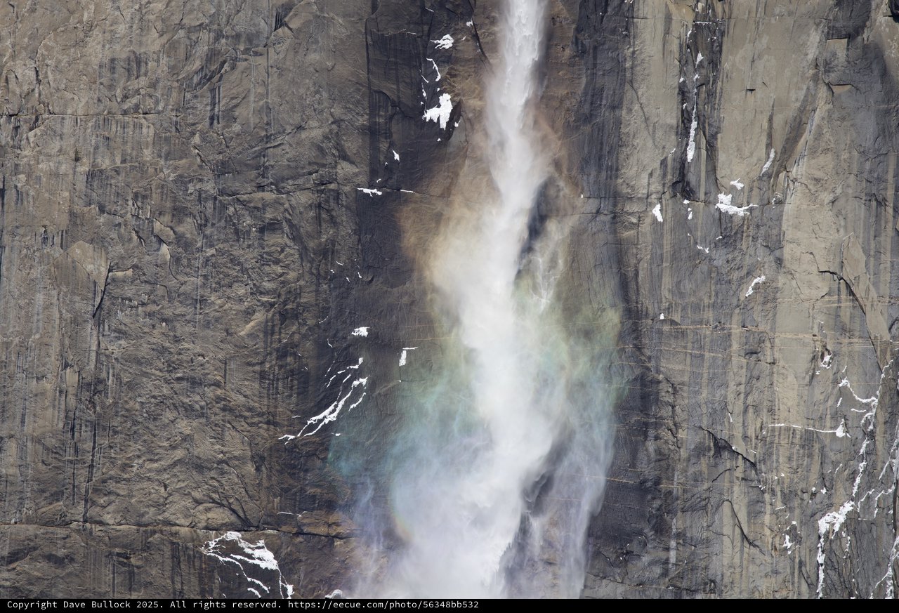Powerful Waterfall Cascading Down Yosemite's Granite Cliff Face