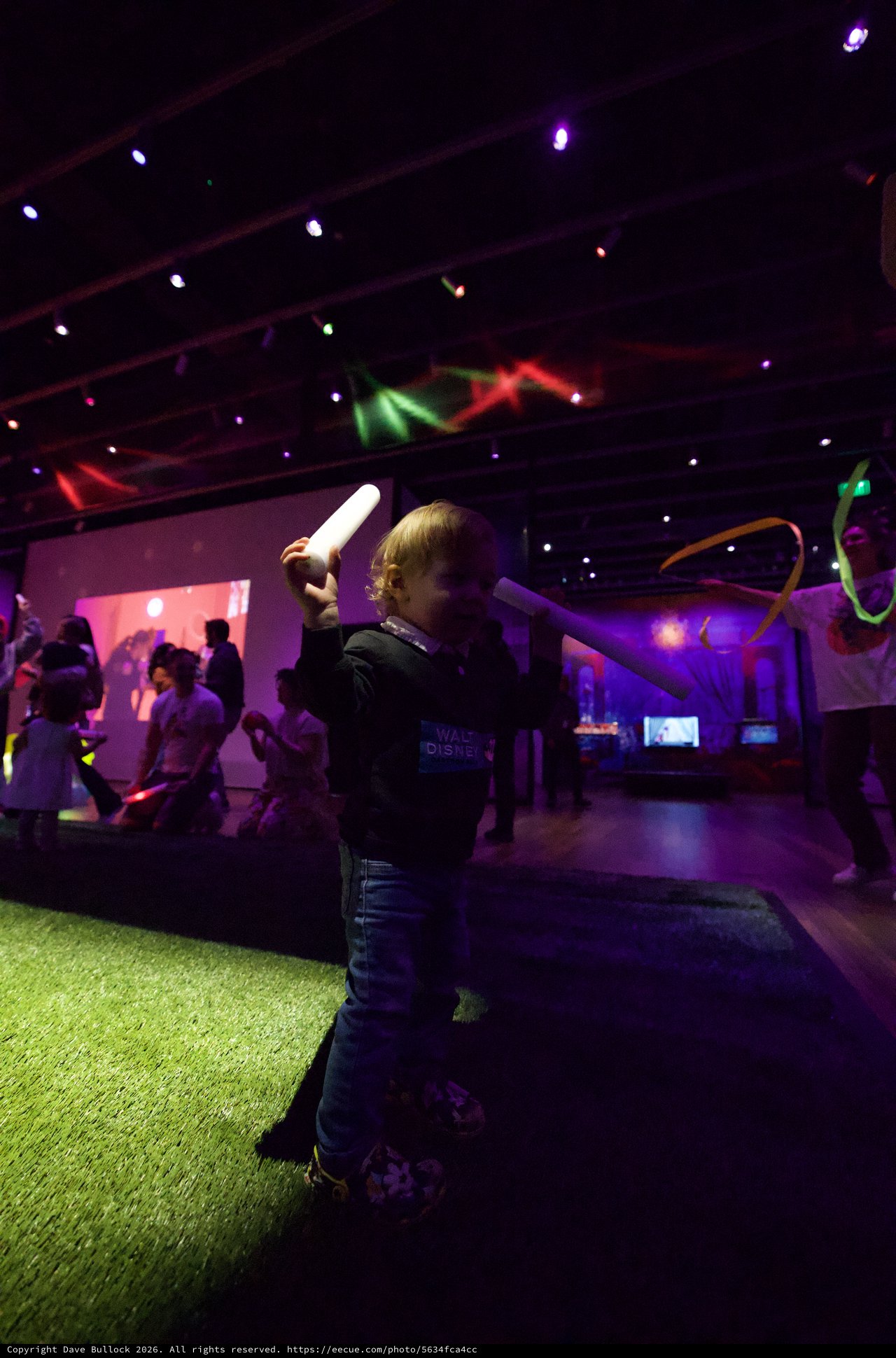 Child Wielding Glow Stick at Baby Rave Dance Party