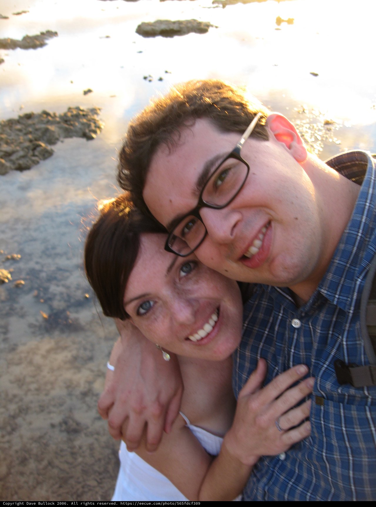 Couple's Joyful Embrace on Fiji Beach at Sunset