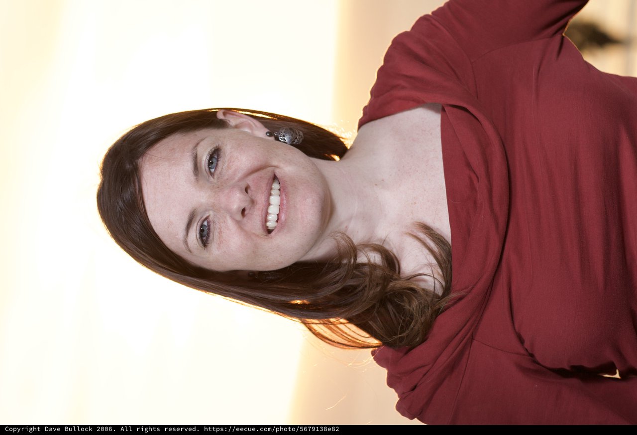 Smiling Woman in Red at Golden Hour