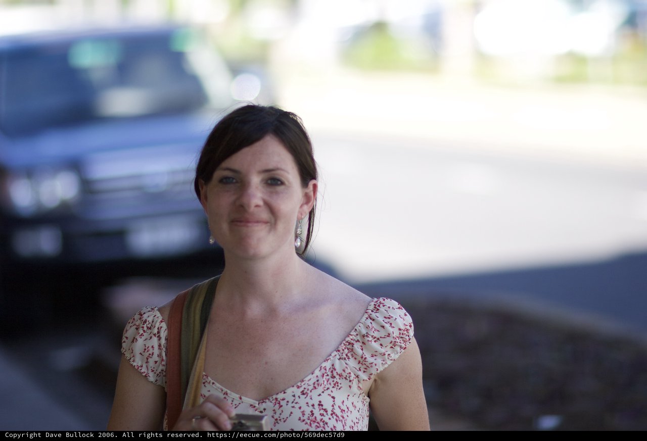 Woman Smiling Outdoors in Floral Summer Dress