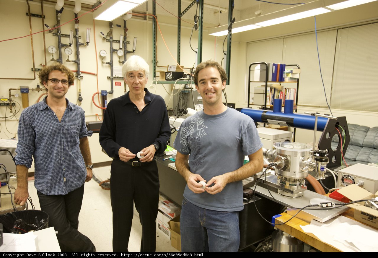 Three Men Operating the Factory Machine in the Lab