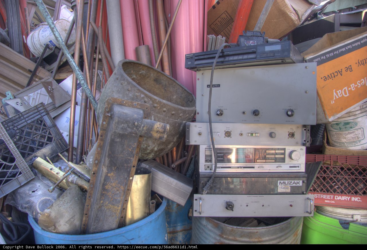 Radio and Other Devices amidst Pile of Manufacturing Waste