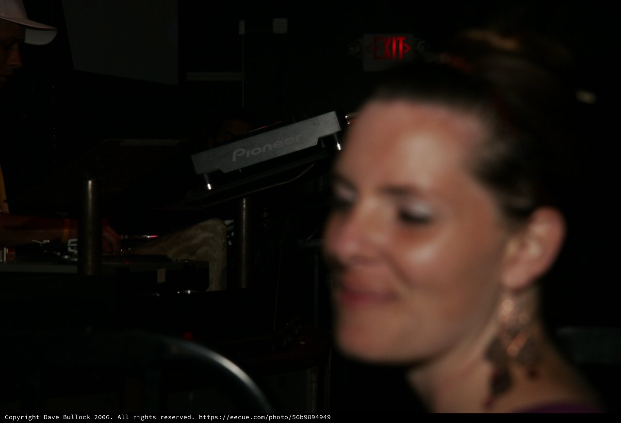 Blurred Portrait of Woman Near DJ Equipment Nightclub