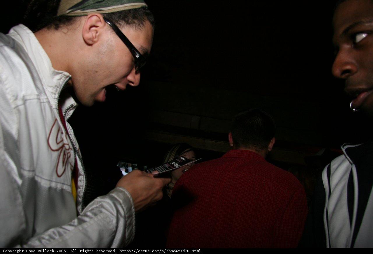 White-Jacketed Man Texting