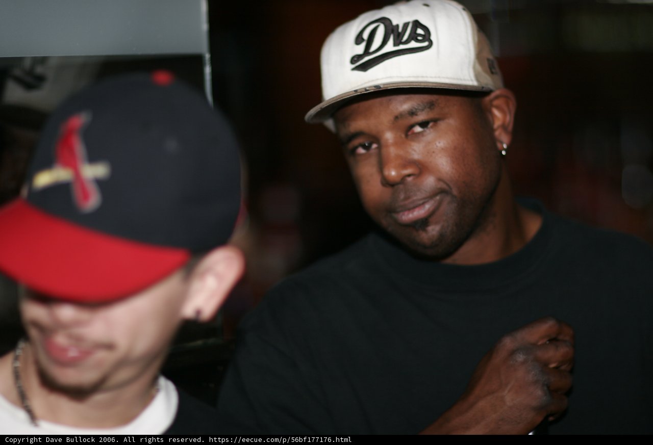 Steve J in Black Shirt and Double Hats