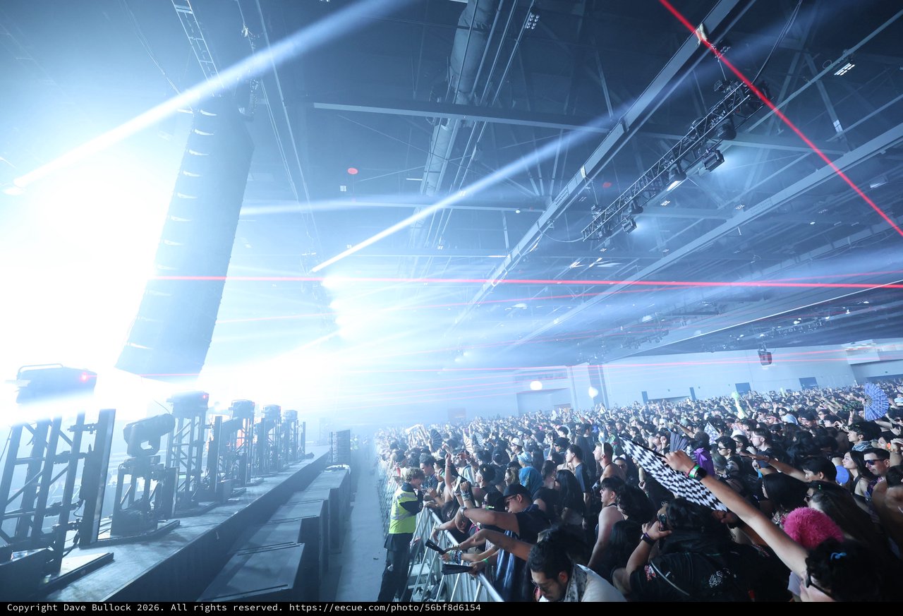 Massive Indoor Rave Crowd Engulfed in Laser Light