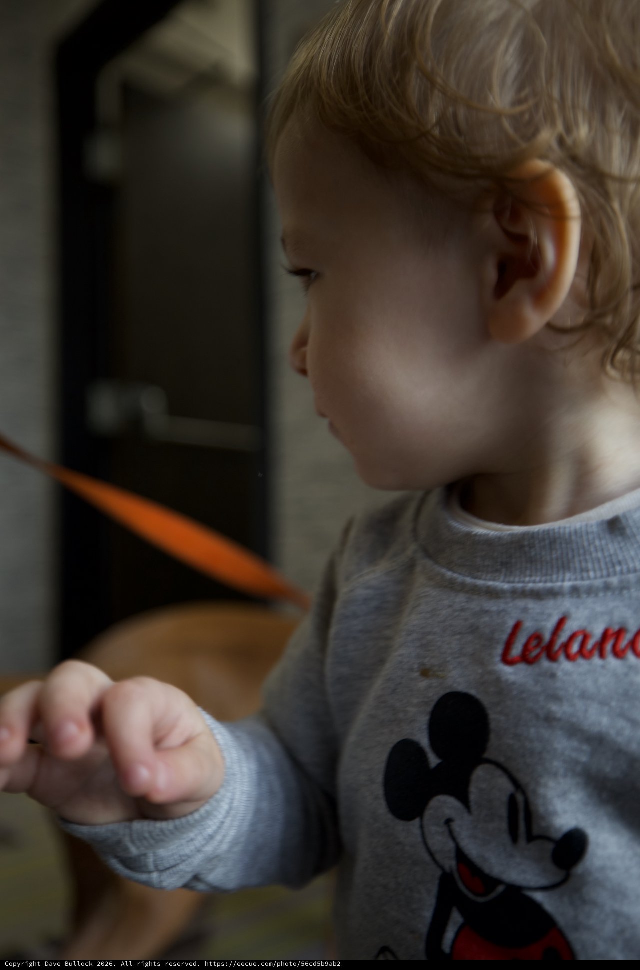 Toddler at Breakfast Table with Mickey Mouse Shirt