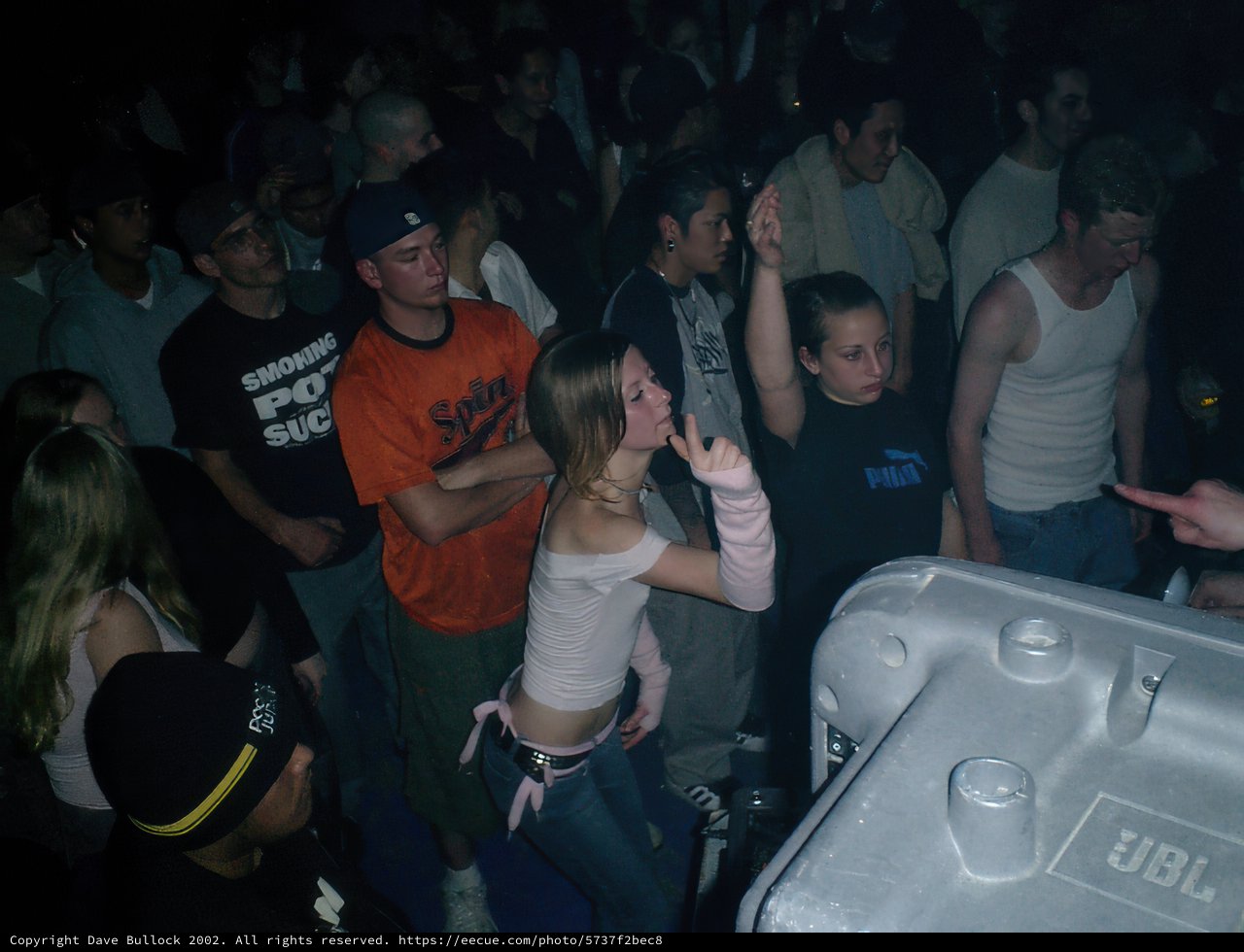 White Tank Top in a Nightclub Crowd