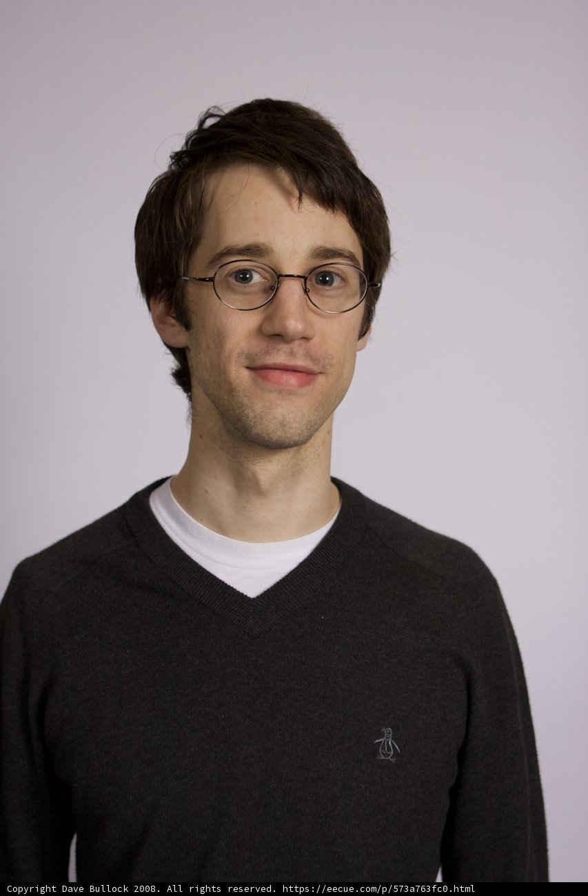 The Happy Man in Glasses and Sweater