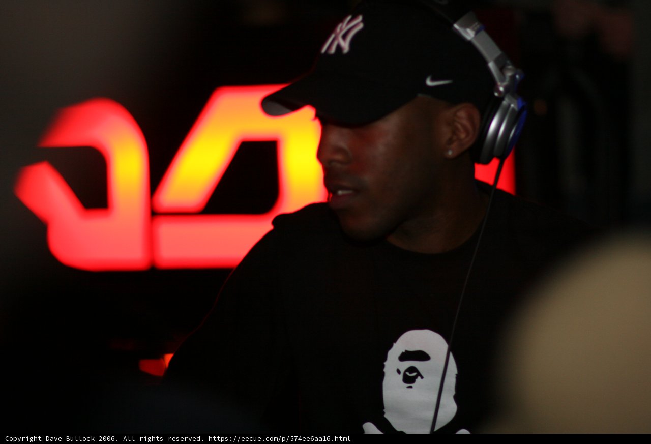Black Shirted Man in a Baseball Cap