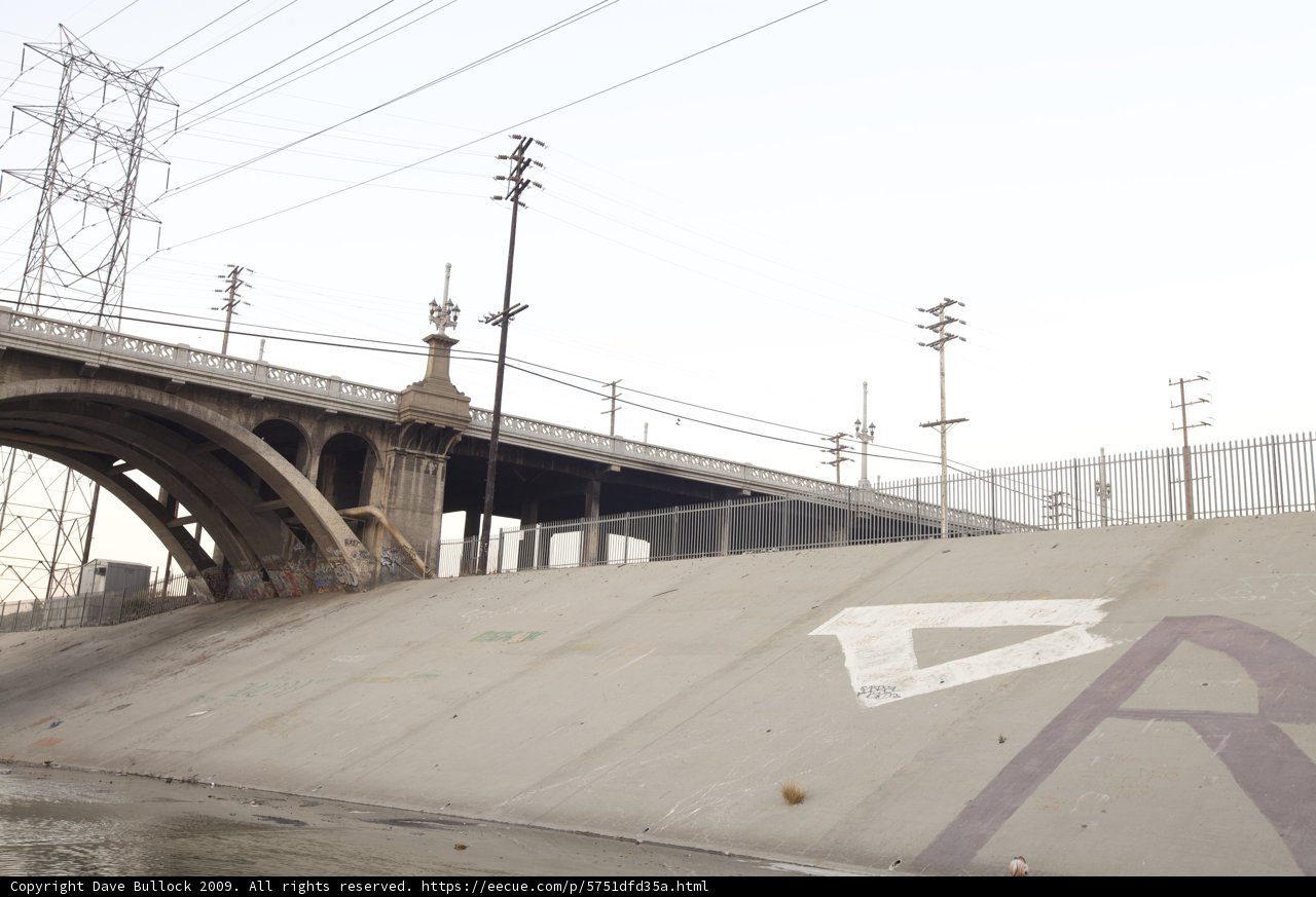 Skateboarding under the freeway overpass