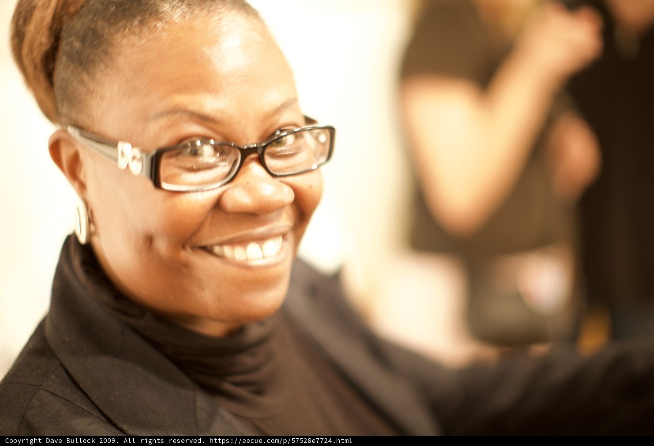 The Happy Woman with Glasses