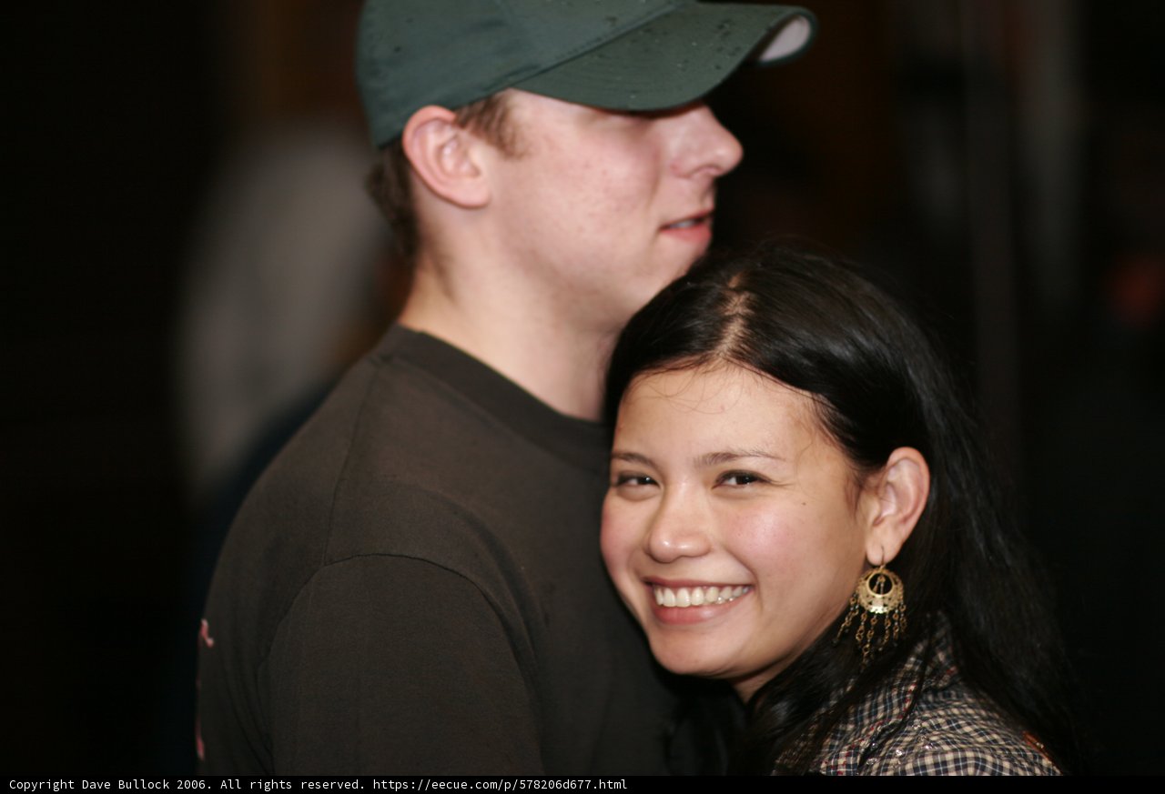 Smiling couple in baseball caps