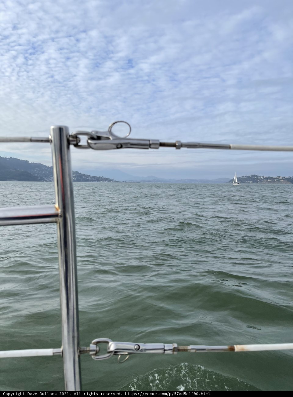 Serene Sail on a Cloudy Day