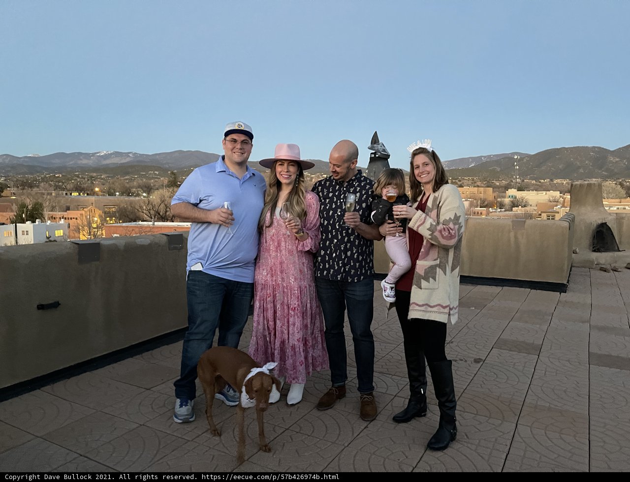 Family Portrait on Santa Fe Rooftop with Their Beloved Pup