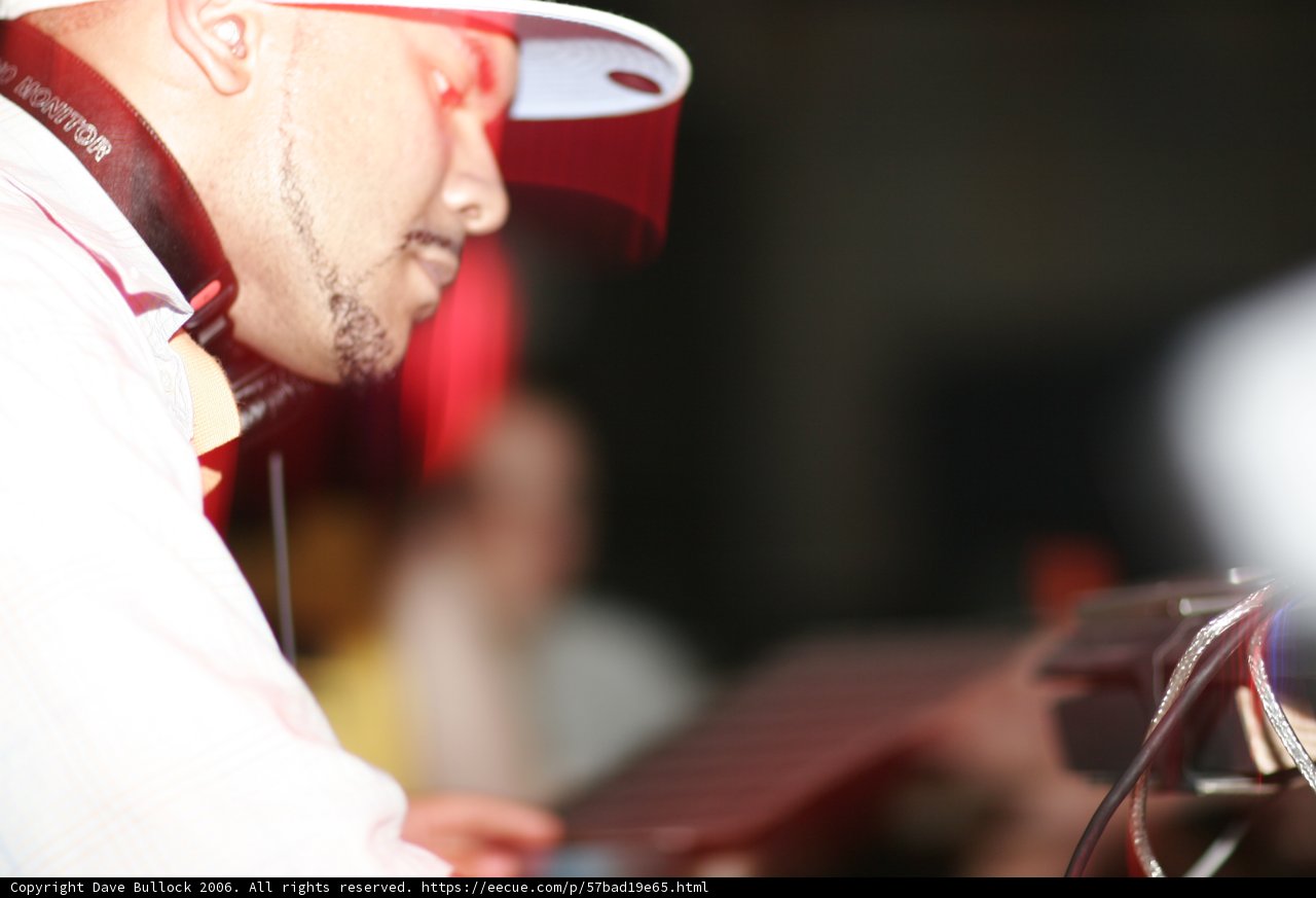 Man with a White Hat and Microphone