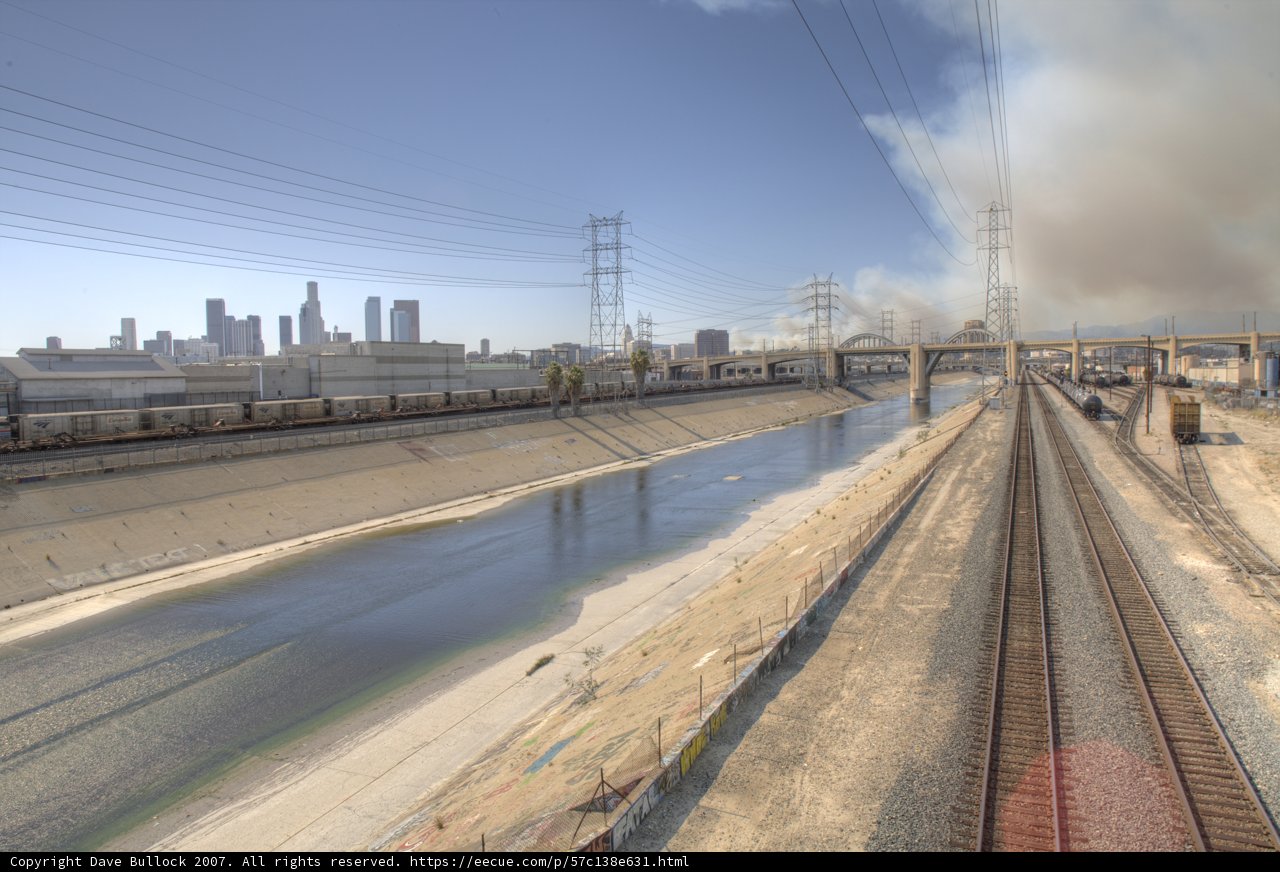Smoke Rising above Railway and River