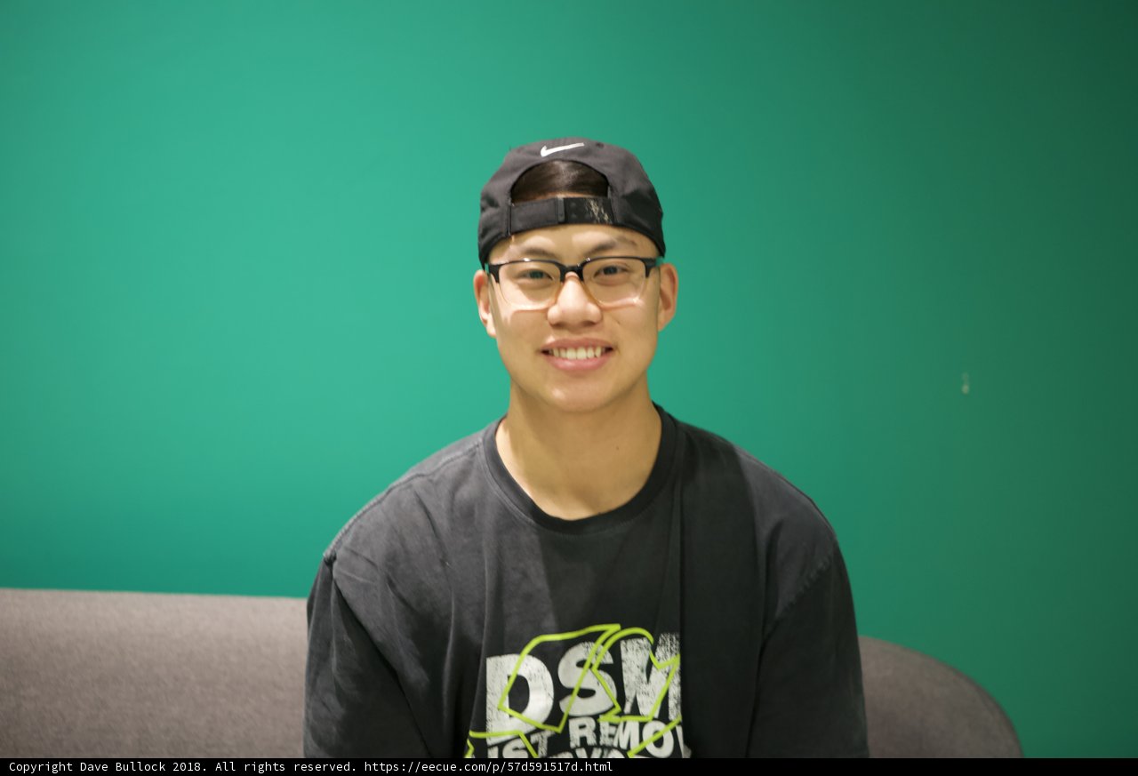 Black Shirt and Hat for a Happy Young Man