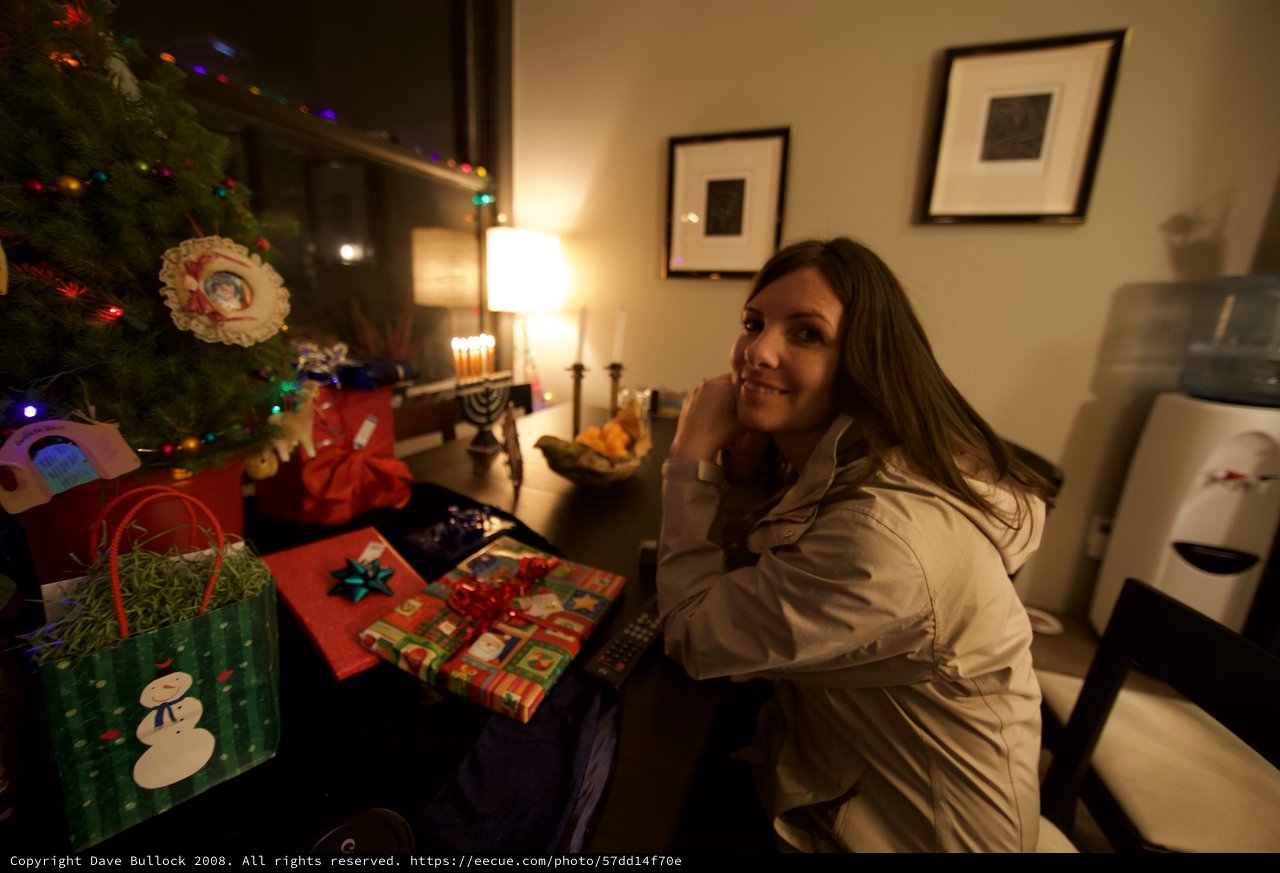 Smiling Woman Celebrates Hanukkah and Christmas Together