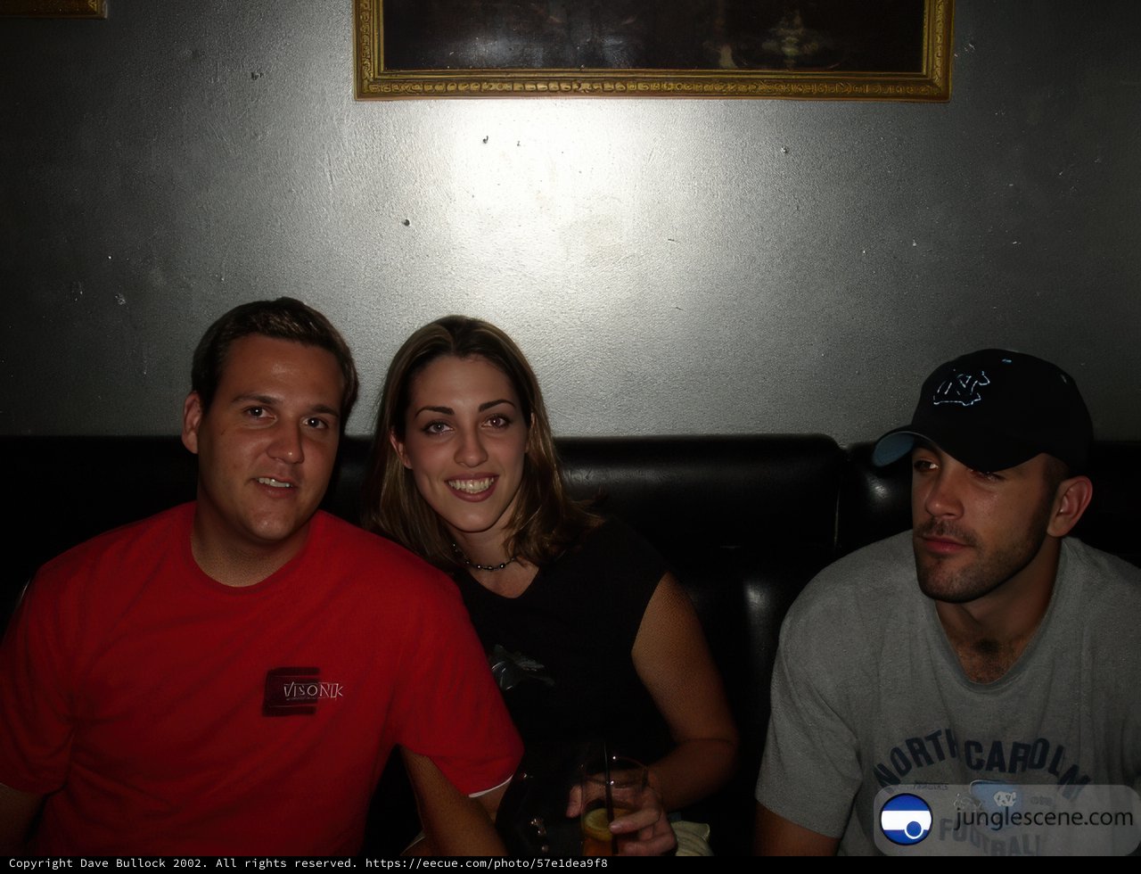 Three Friends Enjoying Each Other's Company on the Couch