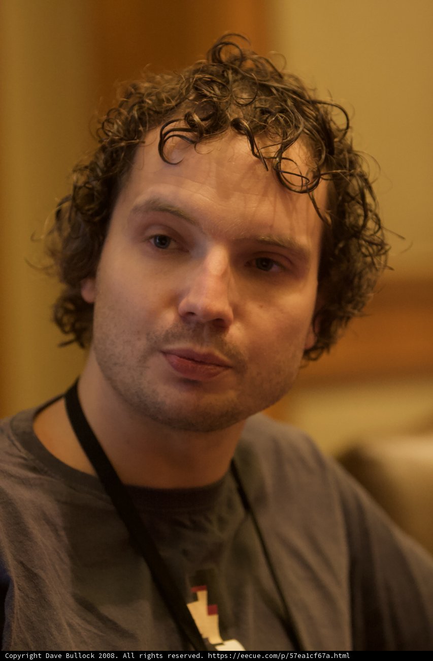 Curly Haired Man with Necklace