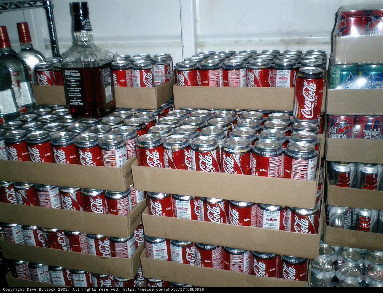 Coca-Cola Cans Piled High in Warehouse