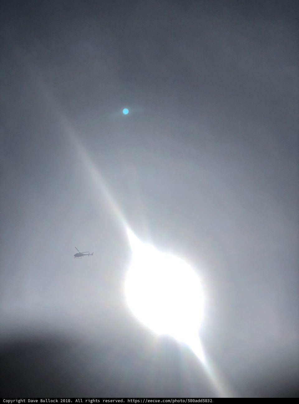 Sun Flare Above High-Flying Plane