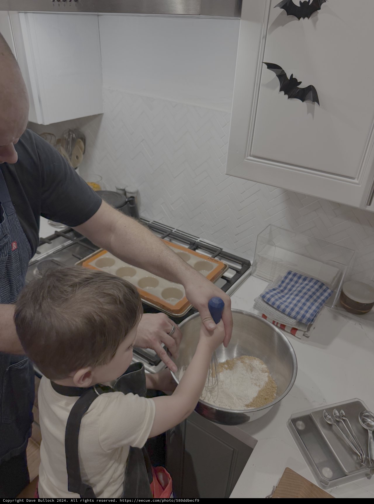 Parent and Child Baking Together in Kitchen