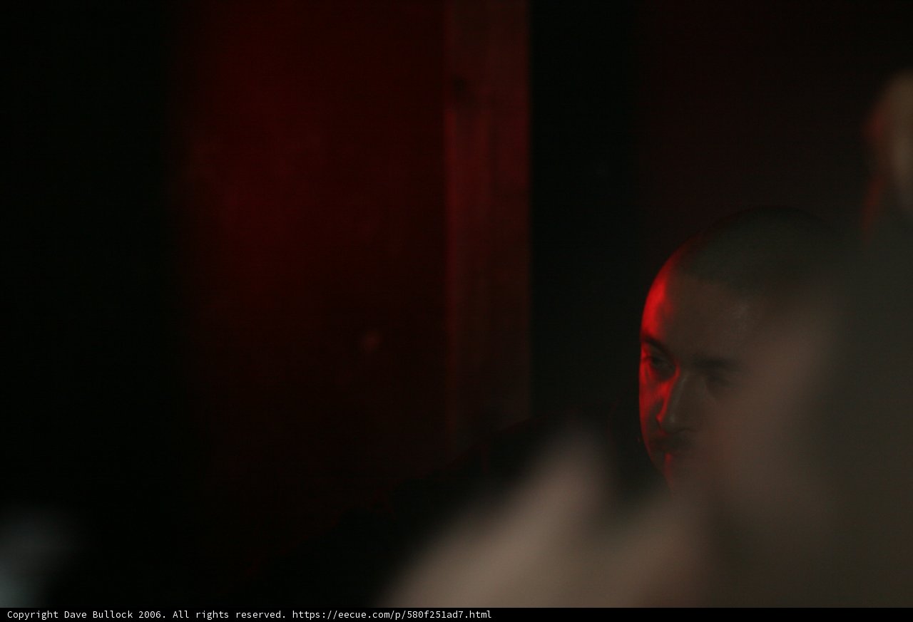 Dark Portrait of a Bald Headed Man