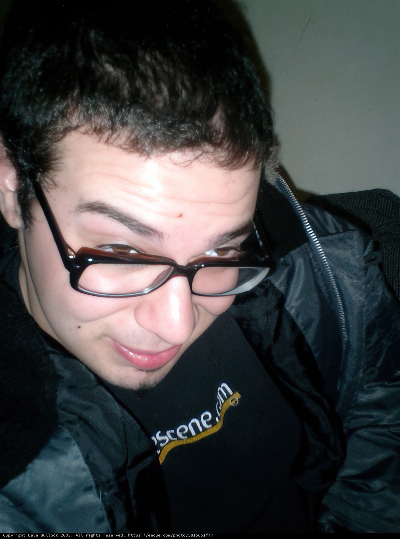 Portrait of a Man in Jacket and Glasses