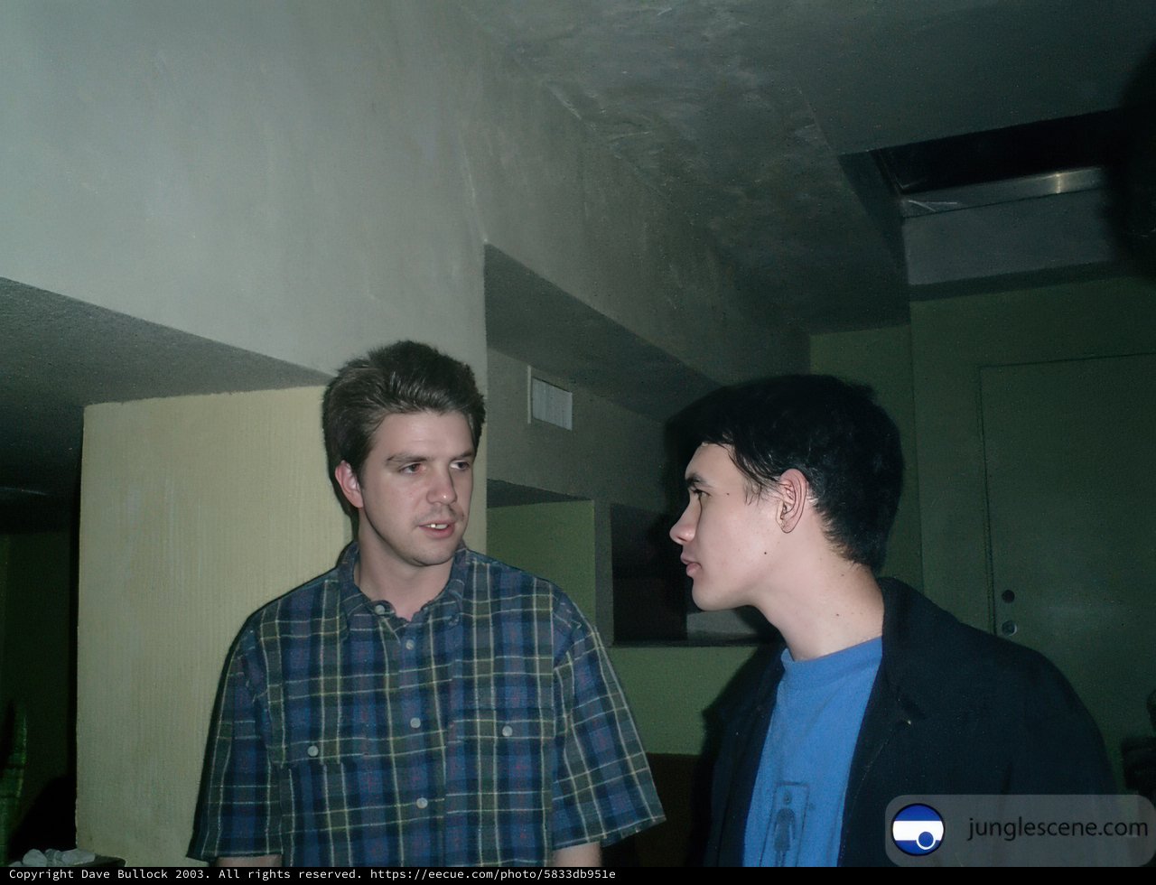 Two Men Deep in Conversation