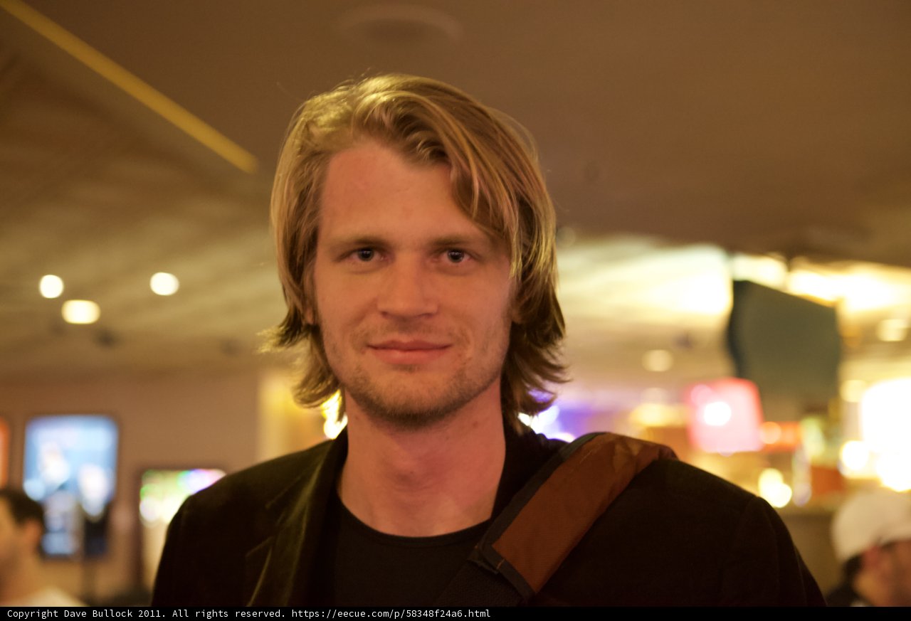 Long-haired man in a cozy pub