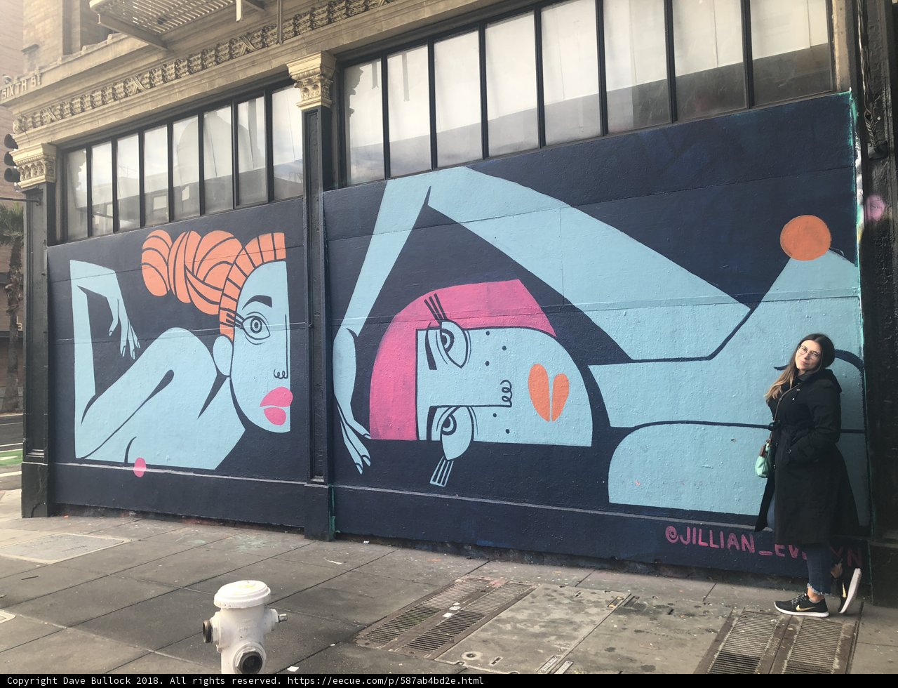 Standing Next to the Mural