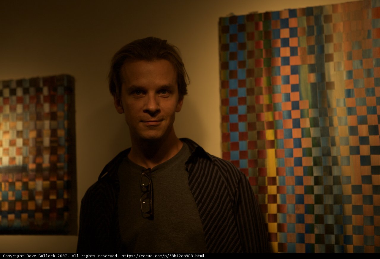 Standing before a wall of art