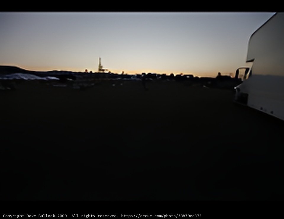 Truck parked at sunset