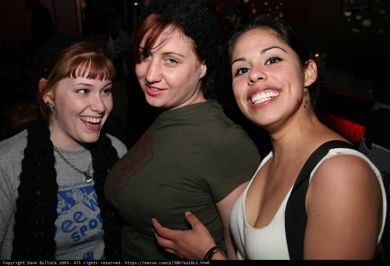 Three Women Celebrate at Nightclub