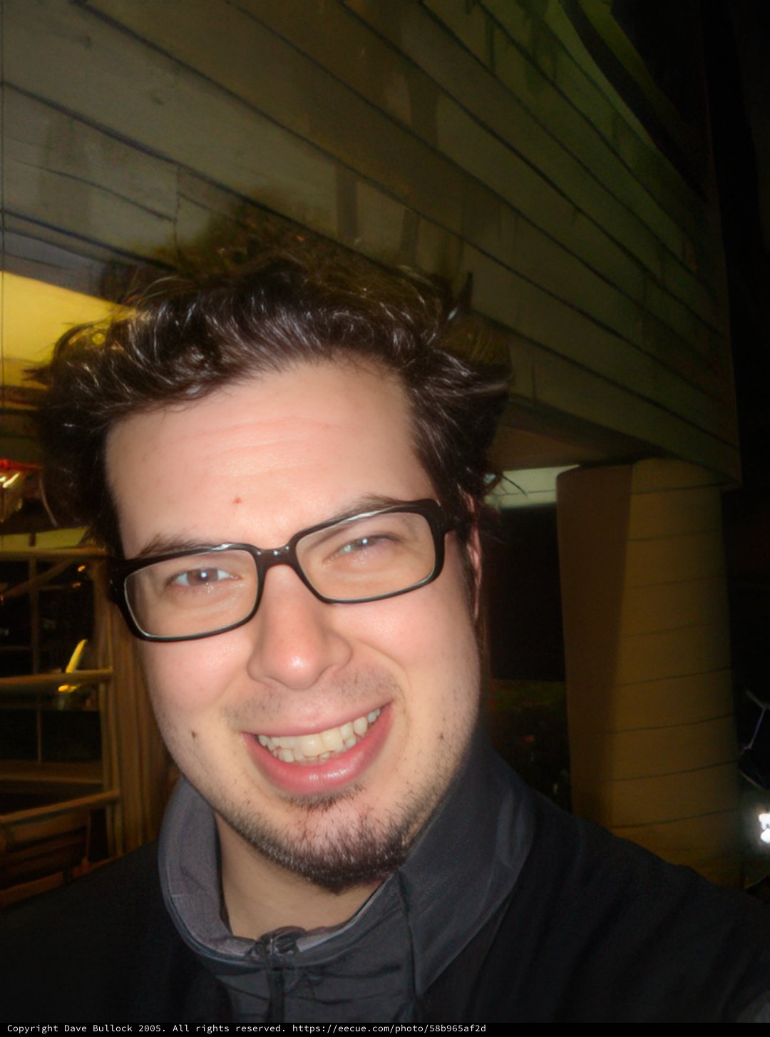 Urban Portrait of a Happy Man with Glasses