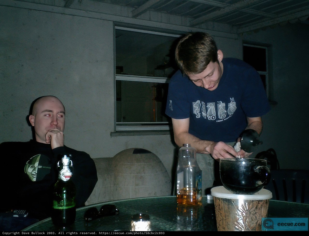 Two Men Enjoying a Beer at the Table