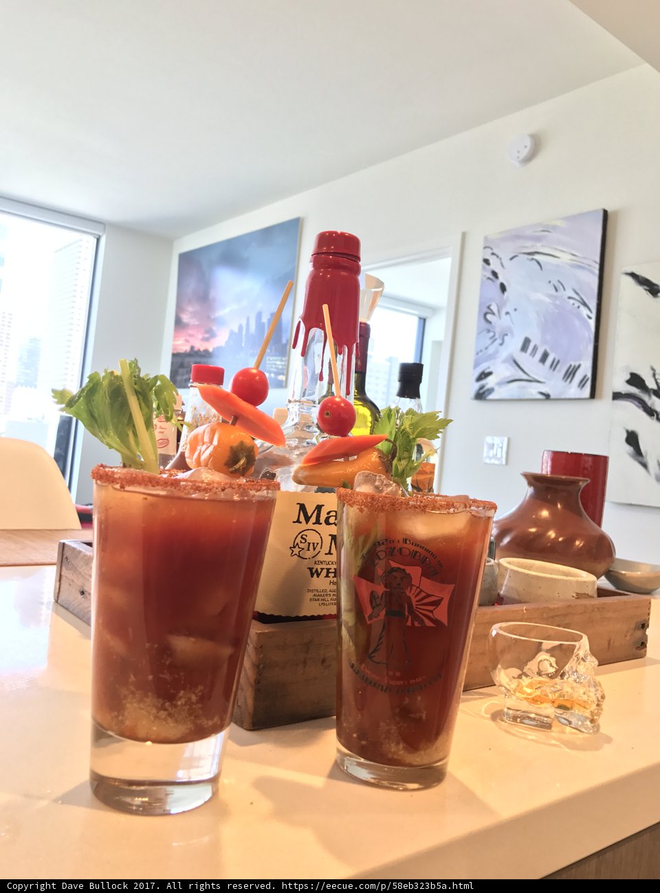 Two Glasses of Bloody Cocktails on a Desk