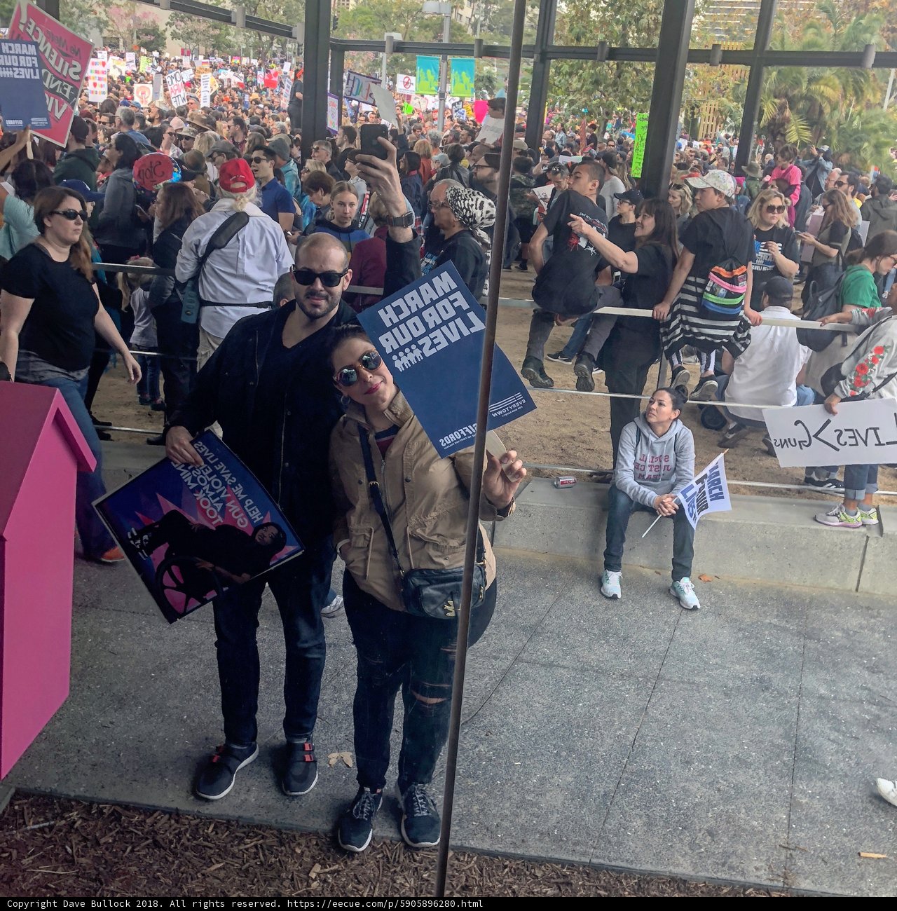 Couple Poses in Front of Vibrant Pink Sign in LA