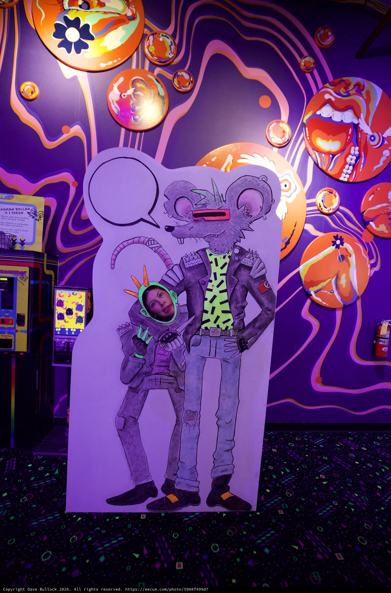 Interactive Photo Cutout at Neon-Lit Arcade Attraction