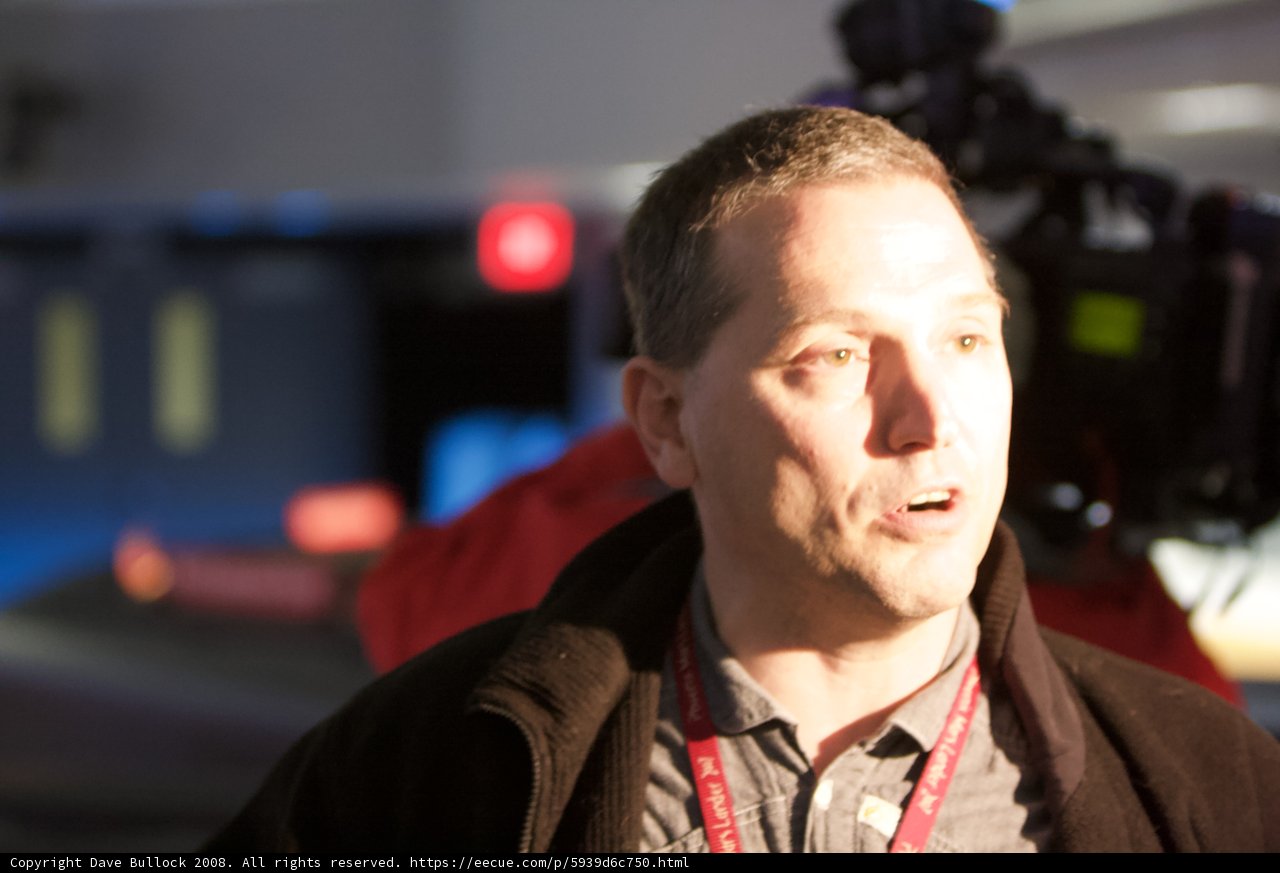 Jacketed Man Talks to Camera