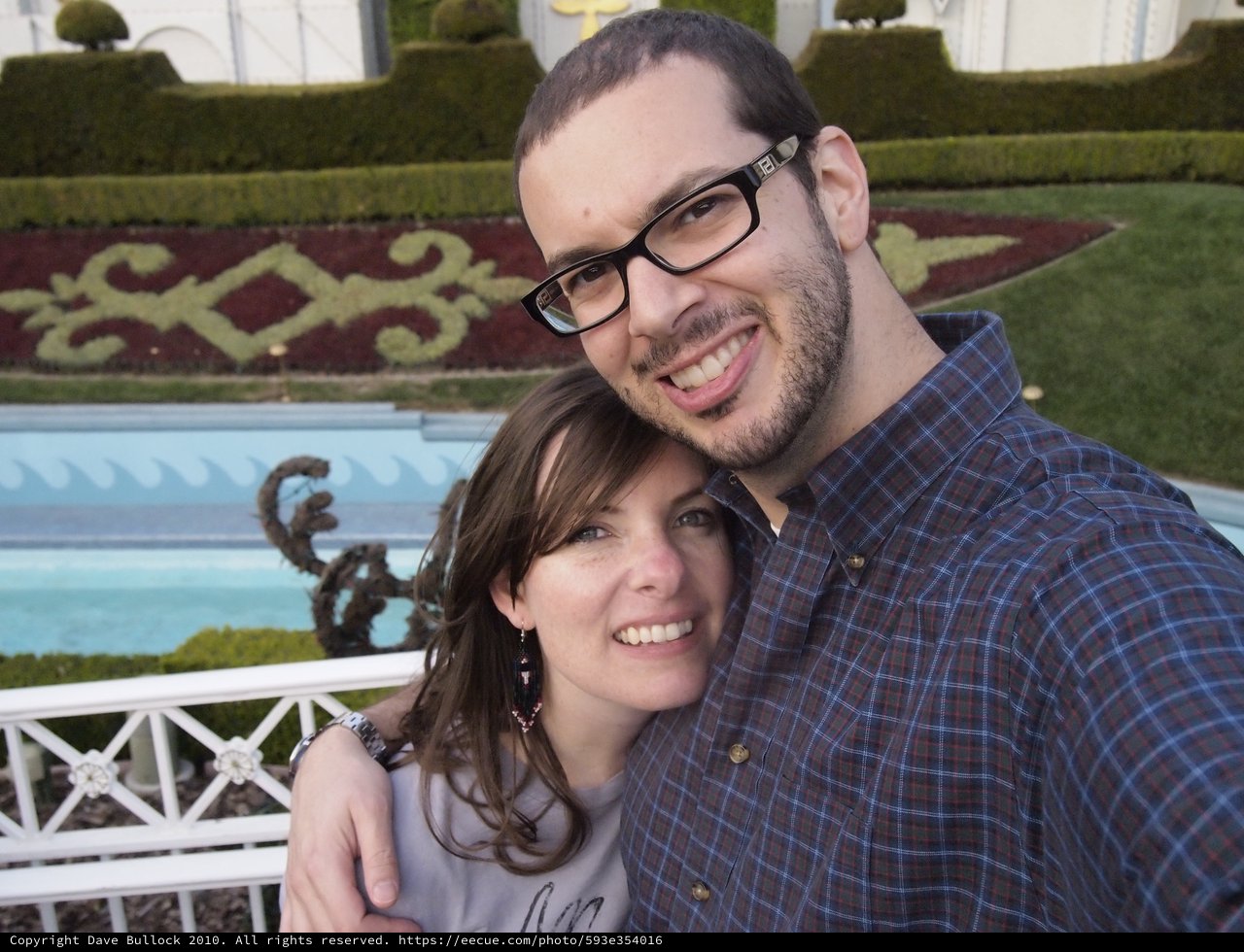 Couple Smiling Together at Decorated Garden Venue