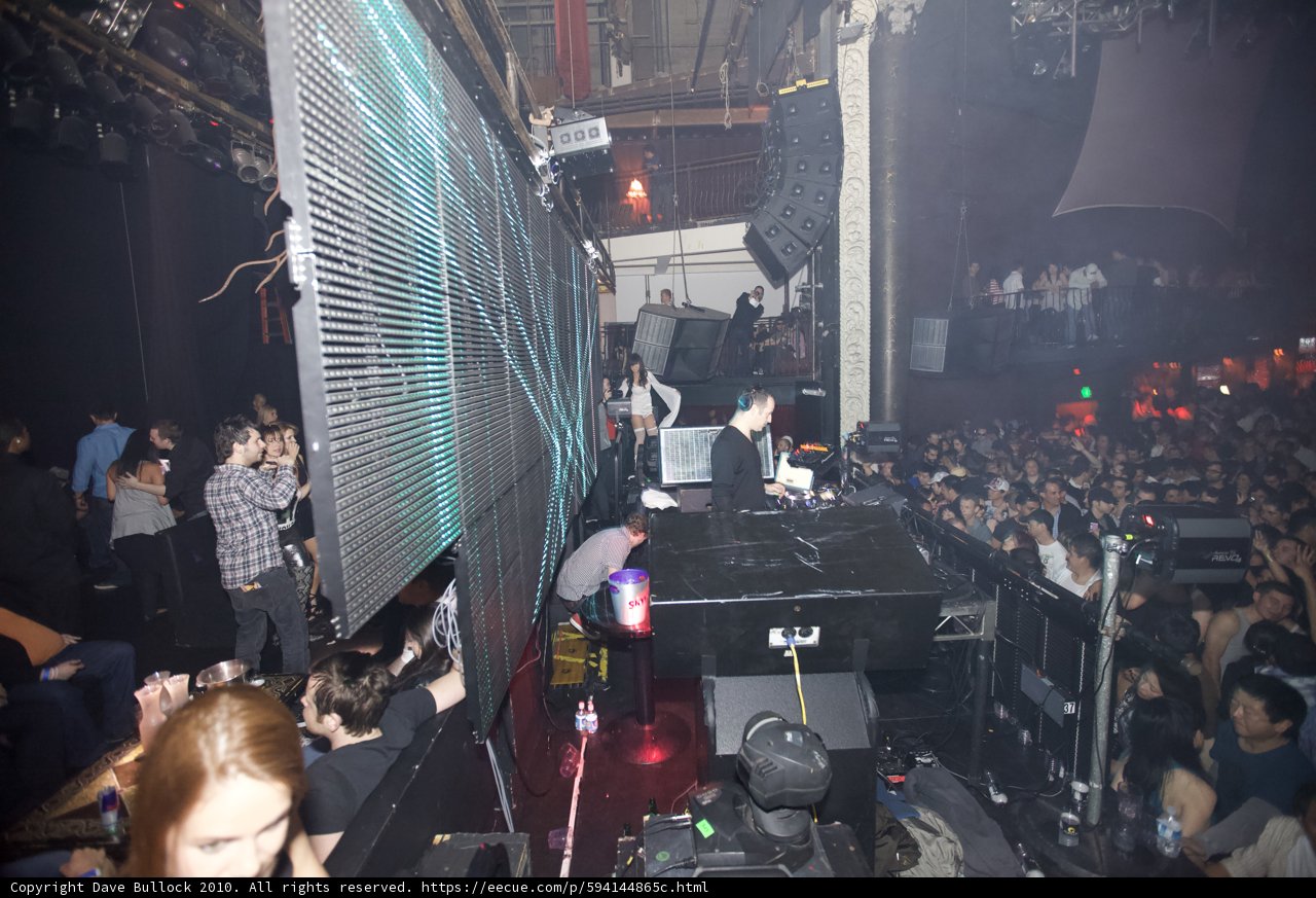 Urban Nightlife: Concert Crowd Grooving to DJ Sasha's Beats