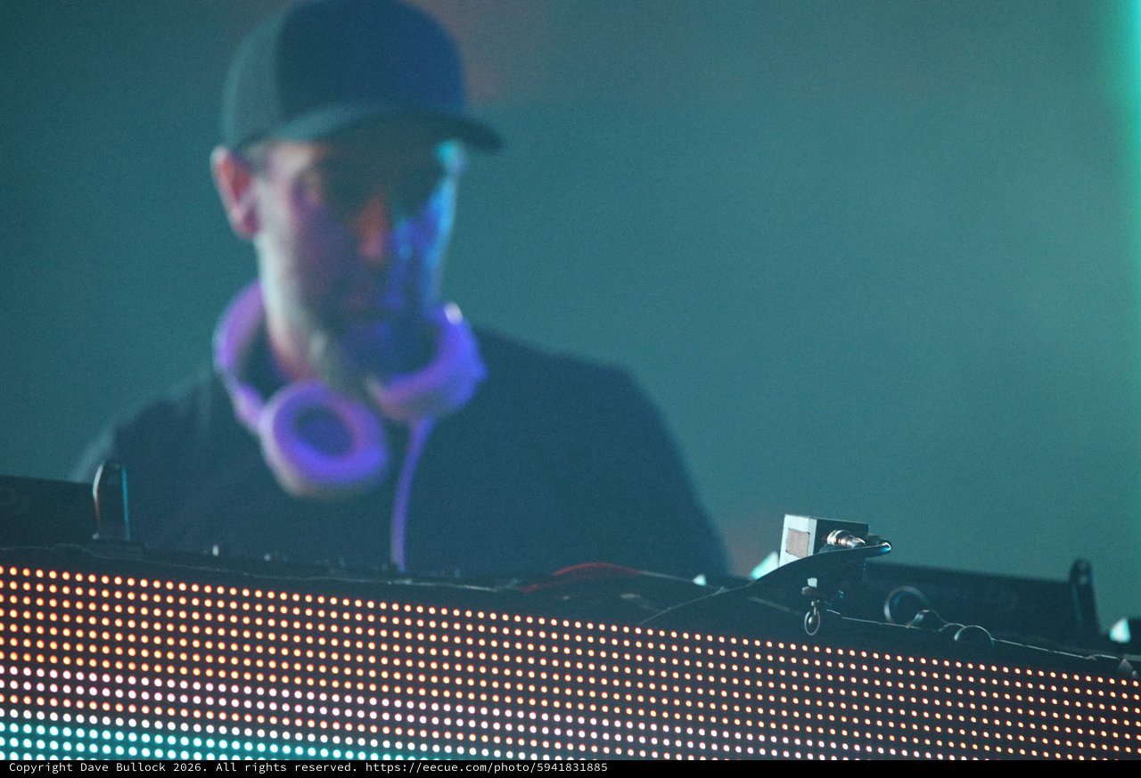 DJ Performs Behind Glowing LED Stage Setup