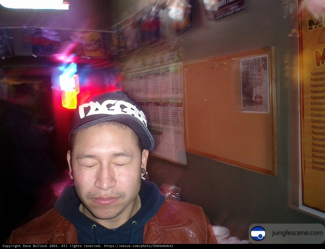Adult Man in Beanie and Jacket Taking Selfie