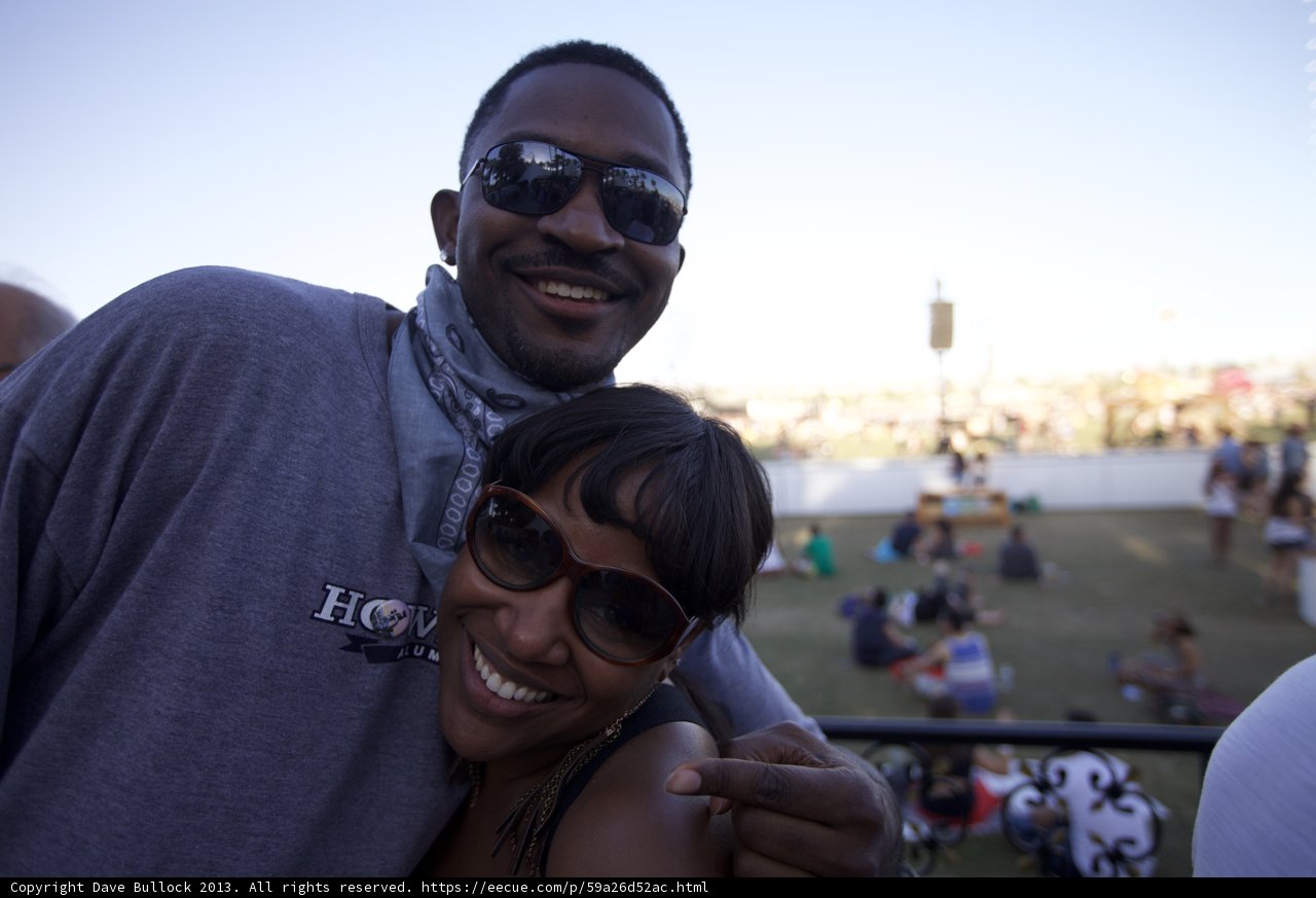Smiling Couple with Sunglasses under Blue Skies