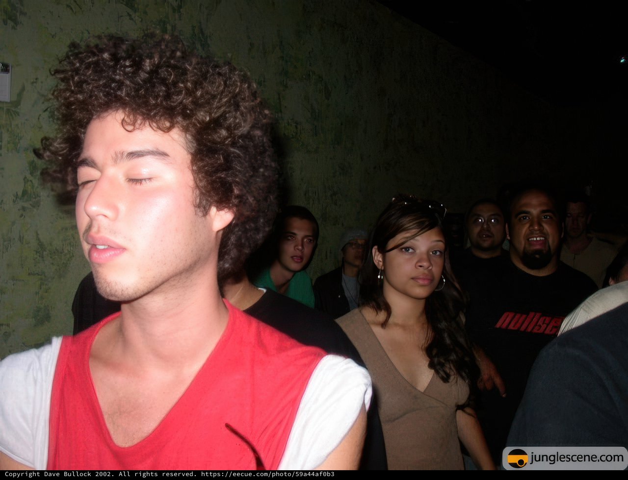Curly Haired Club-goer