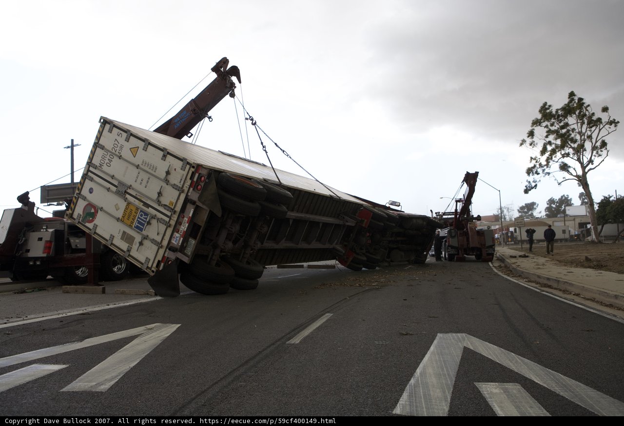 Crane Hoists Overturned Truck on Tarmac